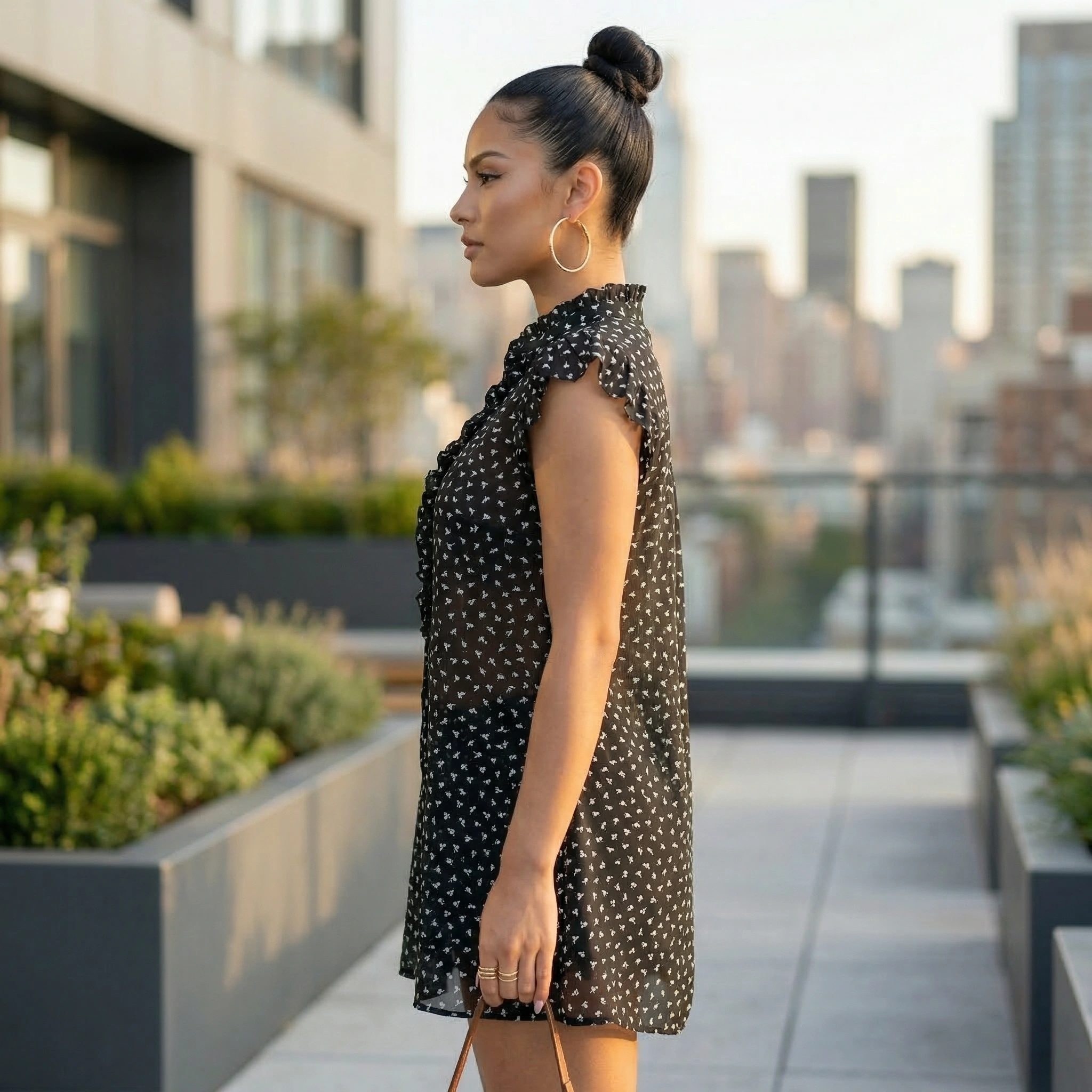 Sleeveless mini dress with white polka dot pattern on black sheer fabric 2